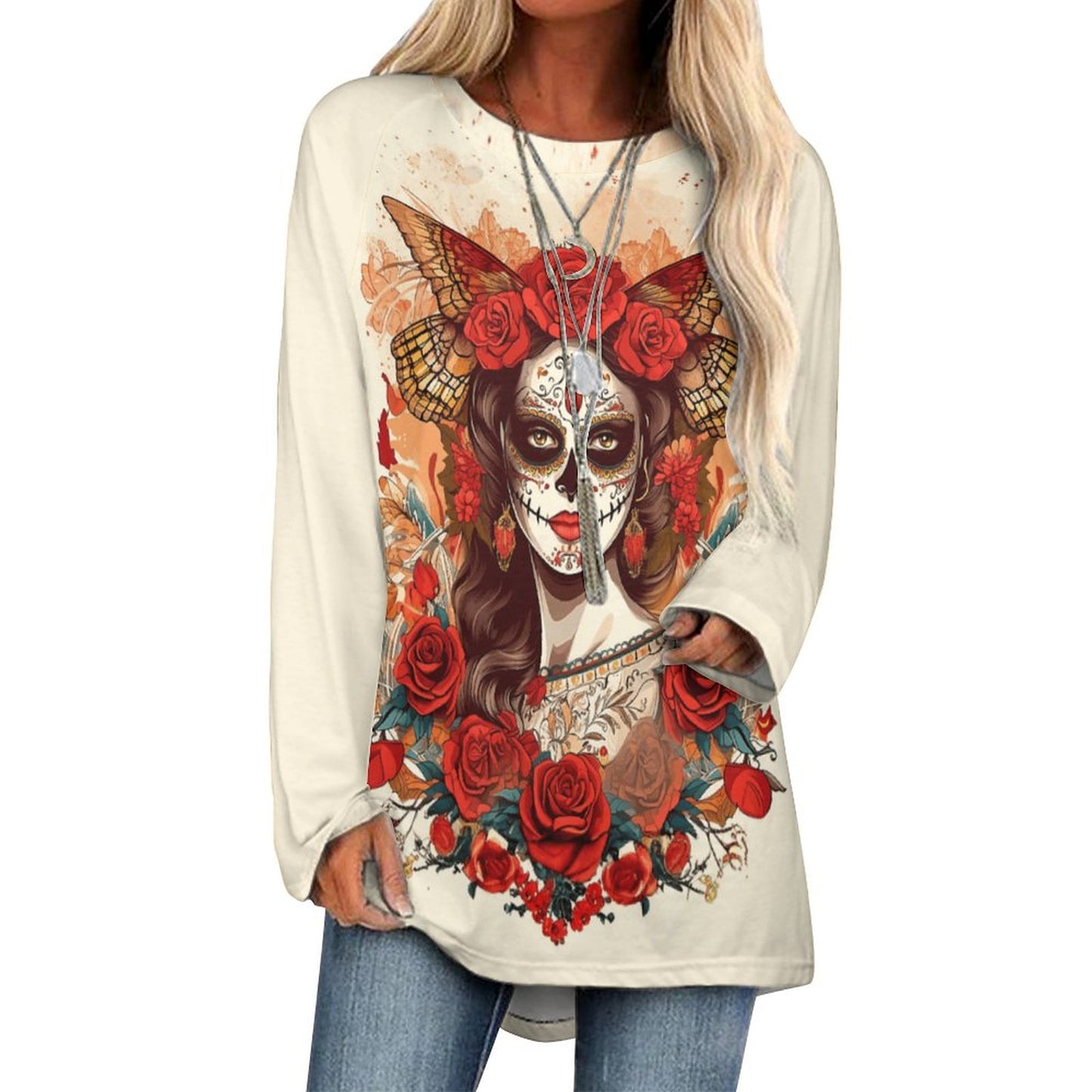 Beige long-sleeve shirt with a colorful skull and floral design worn by a person.
