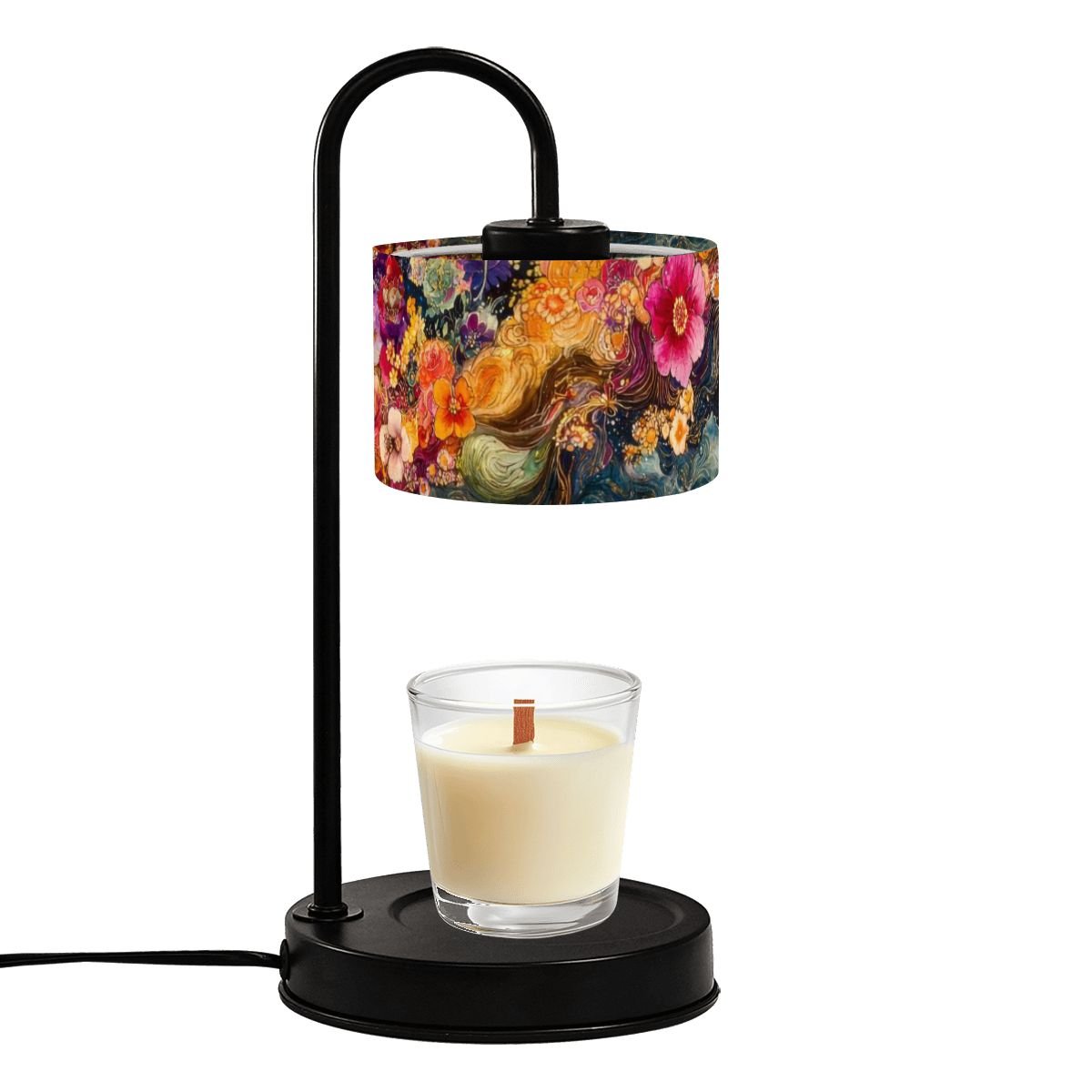 Table lamp with floral shade and candle on a white background