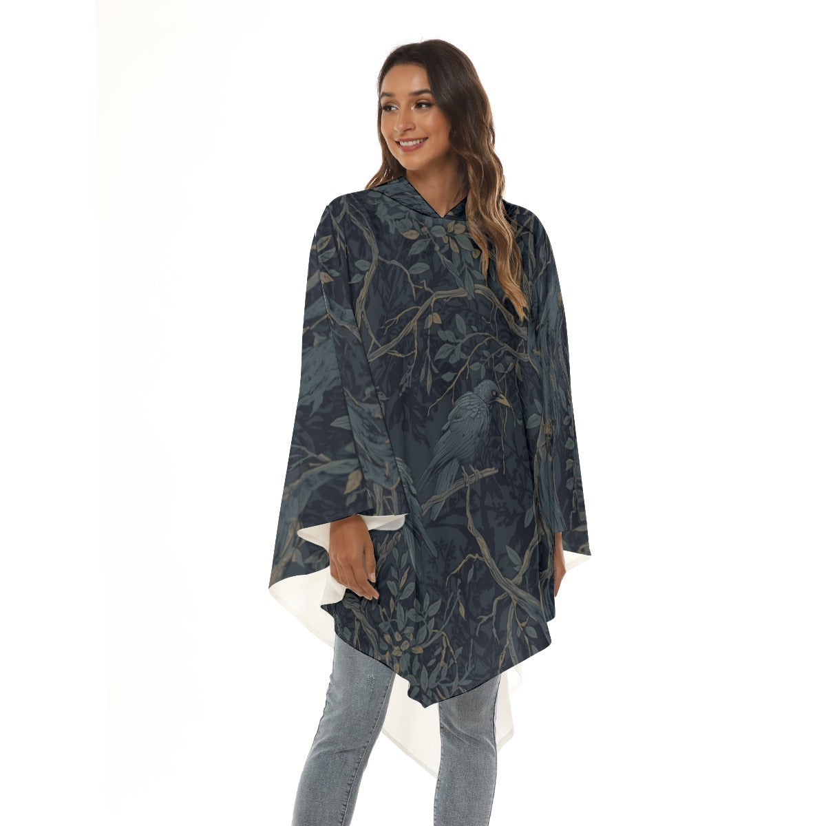 Woman wearing a dark green floral-patterned poncho on a white background