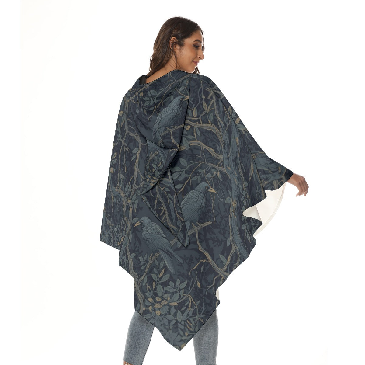Woman wearing a dark blue patterned poncho on a white background