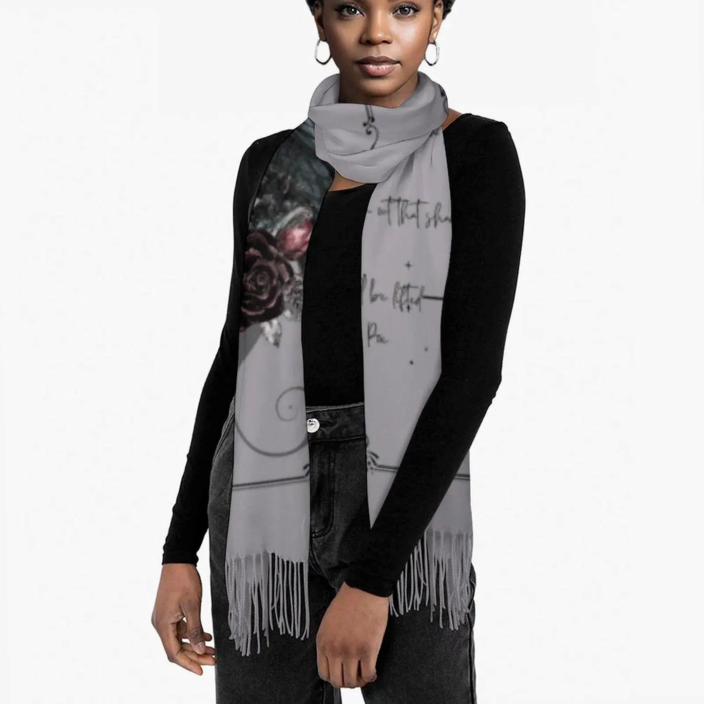 Woman wearing a gray scarf with artistic designs on a white background