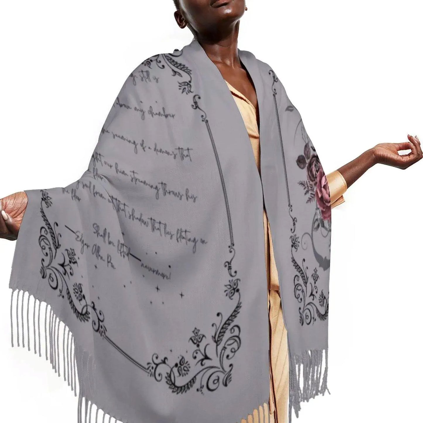 Woman wearing a gray scarf with black patterns and fringes on a white background