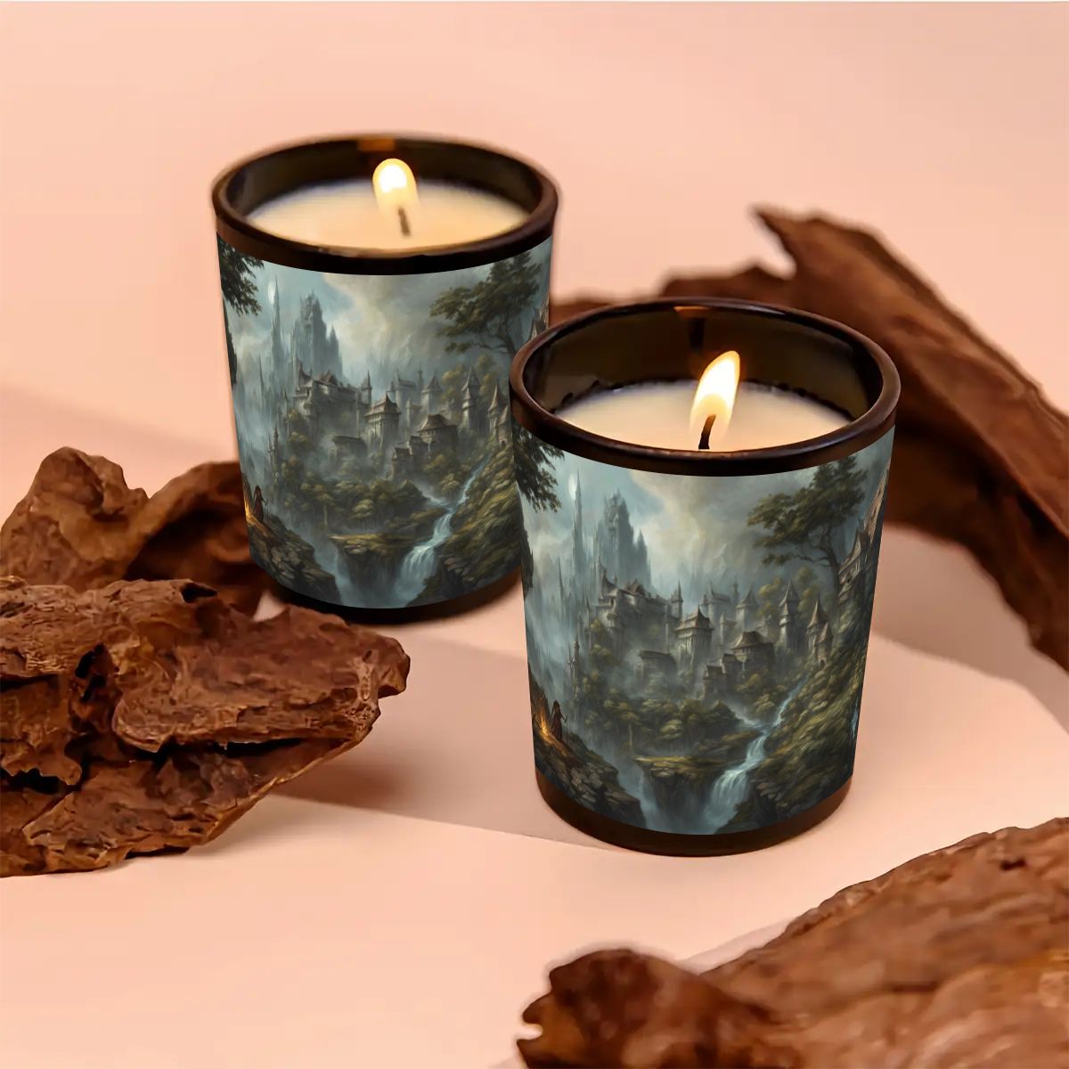 Two lit candles in artistic tins surrounded by natural elements on a soft pink background