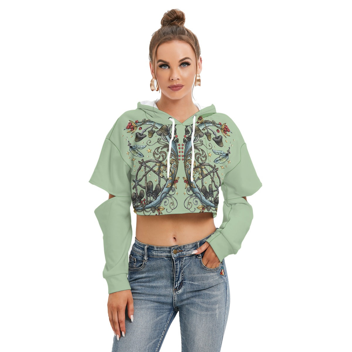 Woman wearing a green crop top hoodie with floral patterns on a white background