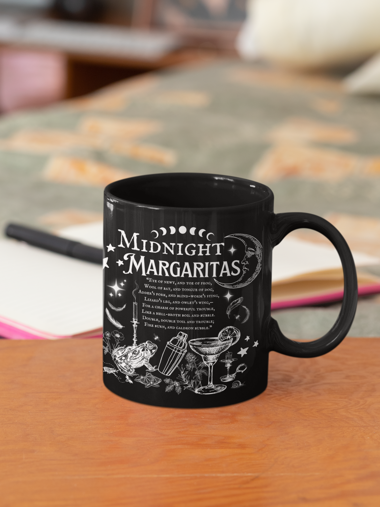 Black mug with 'Midnight Margaritas' design on a wooden surface