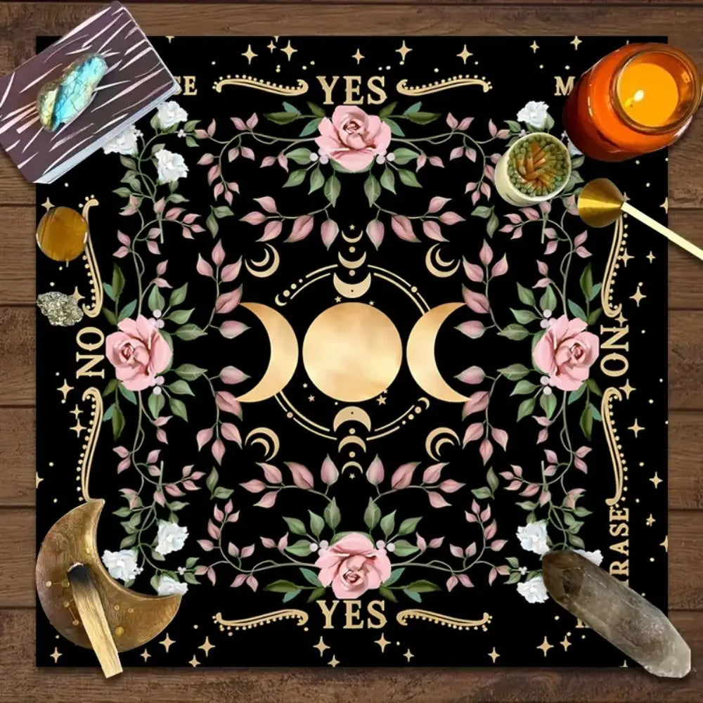 Decorative board with a moon symbol, flowers, and占卜 tools on a wooden surface.