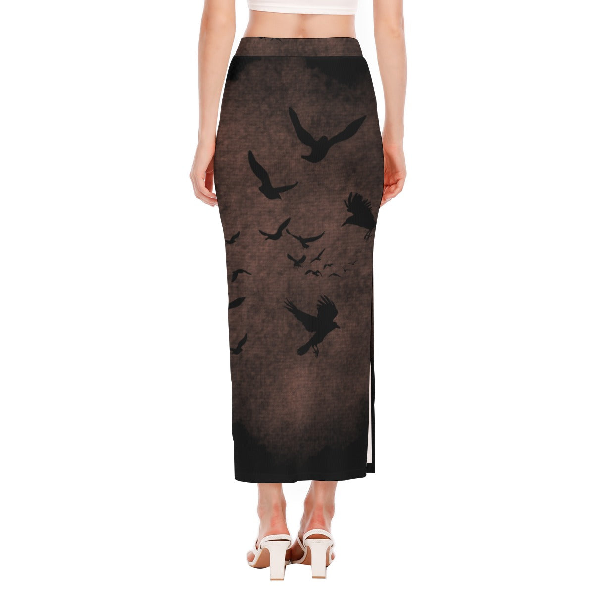 Long skirt with bird pattern worn by a model on a white background
