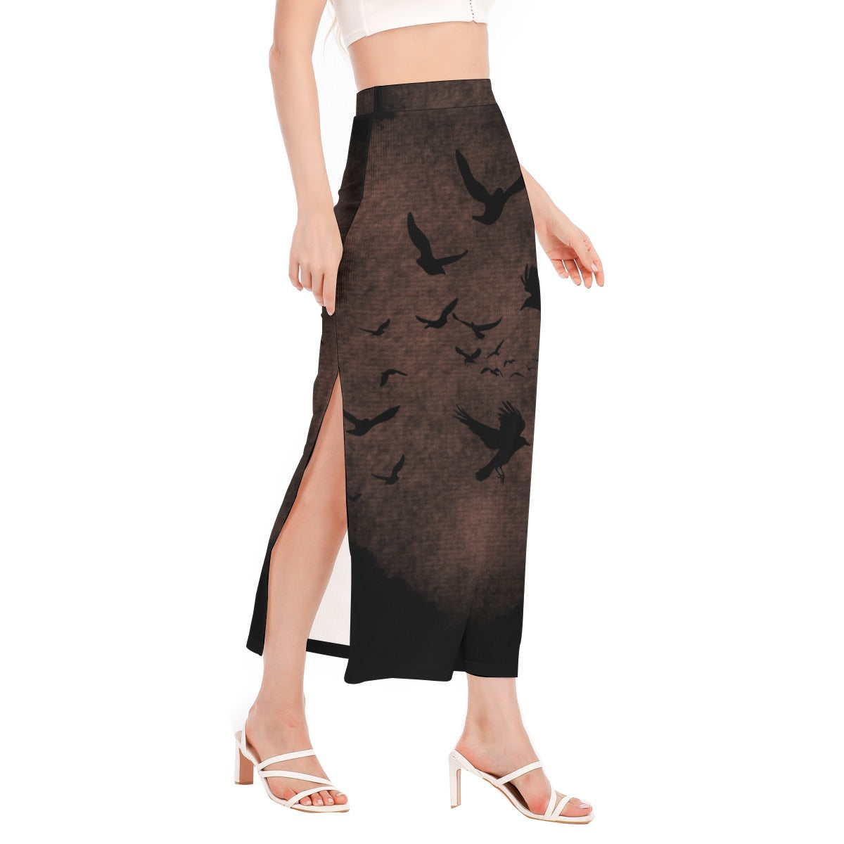 Black skirt with bird pattern worn by a person on a white background