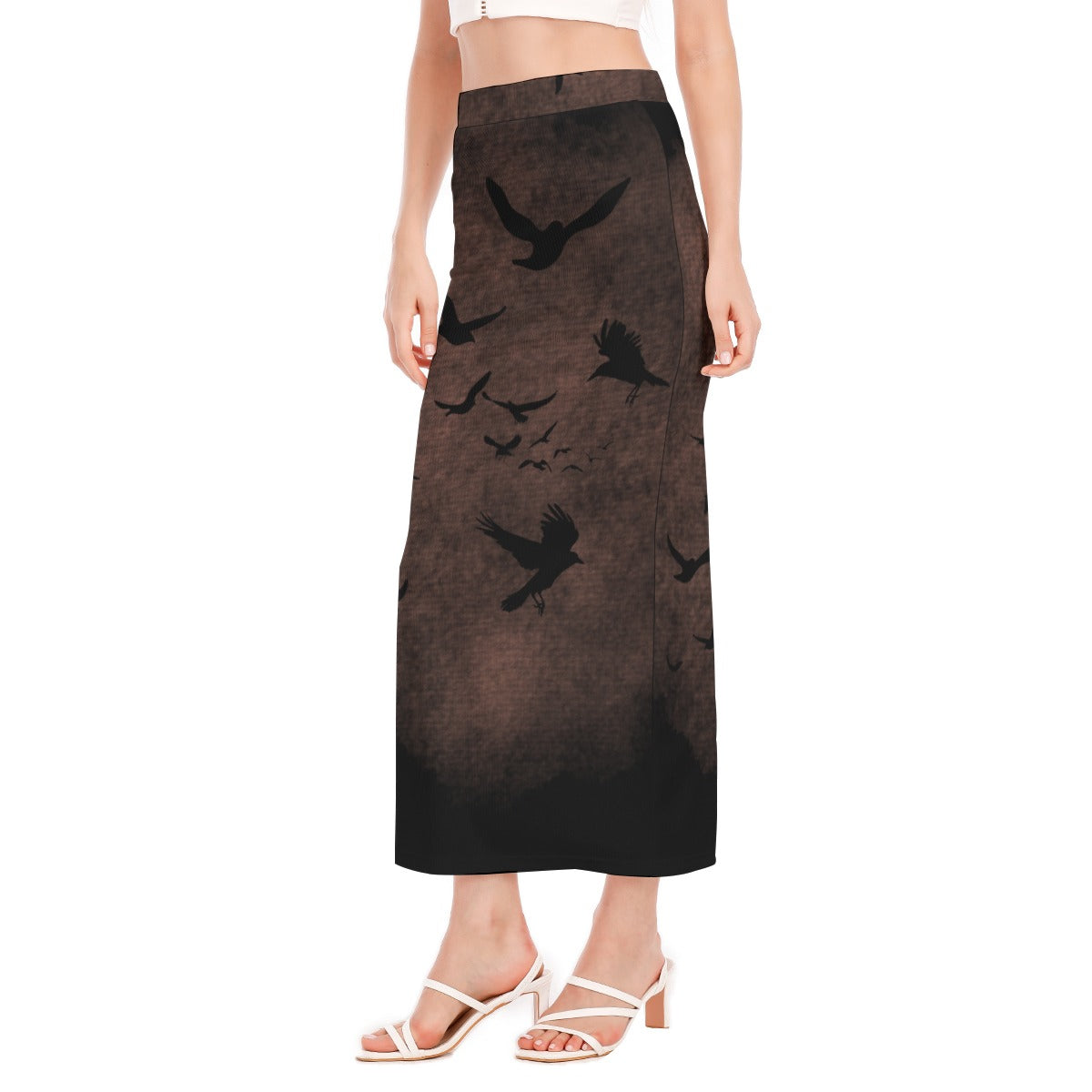 Skirt with black bird pattern worn by a person on a white background