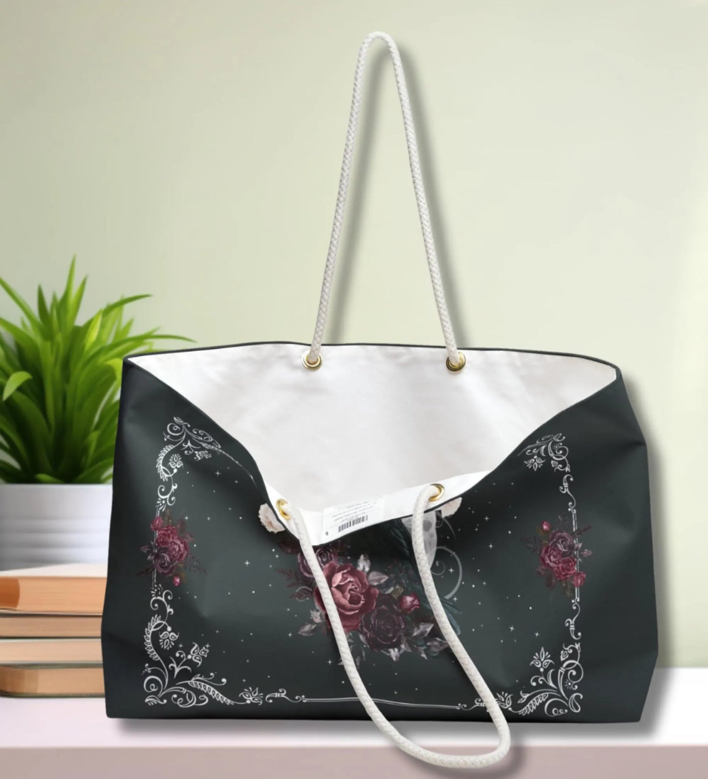 Black and white tote bag with floral design on a light background