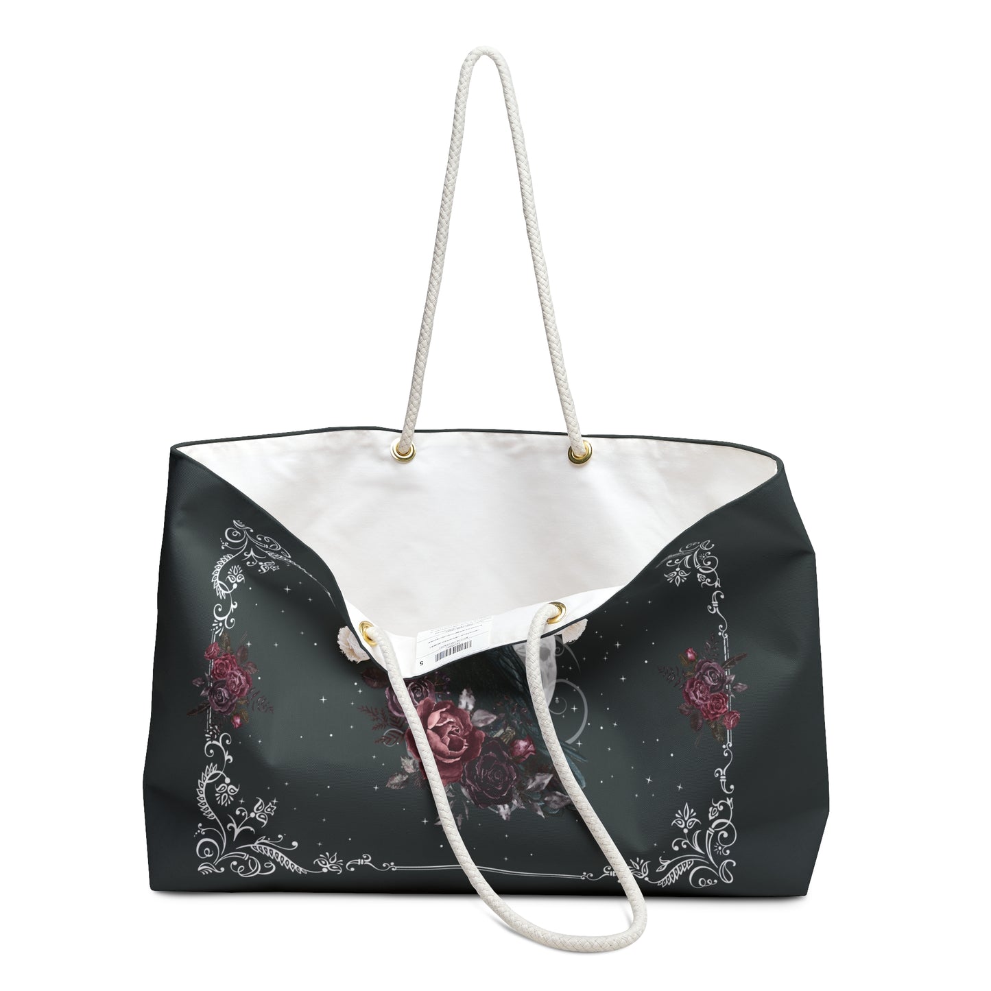 Black tote bag with floral design and white drawstring on a white background