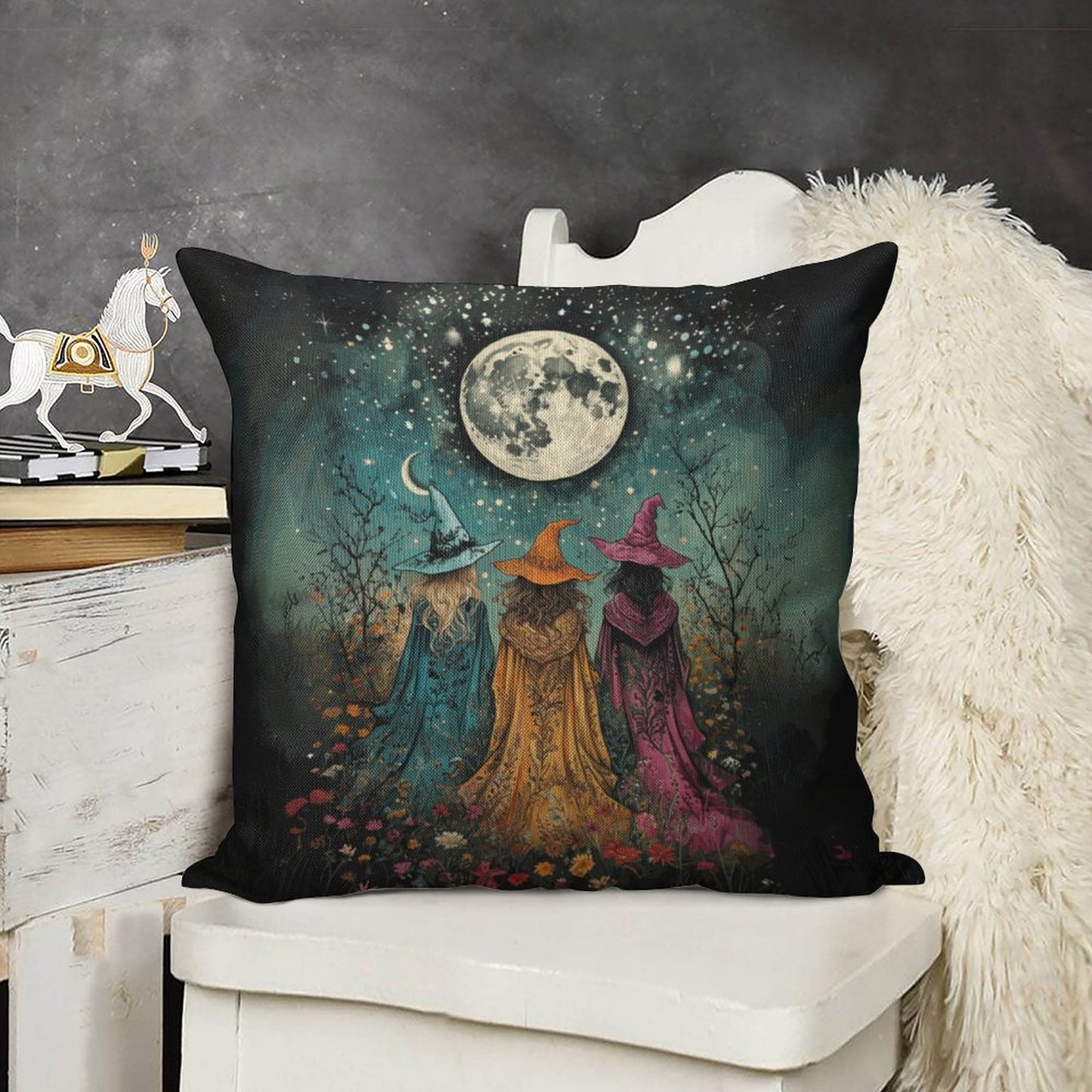 Decorative pillow with witch design on a white surface