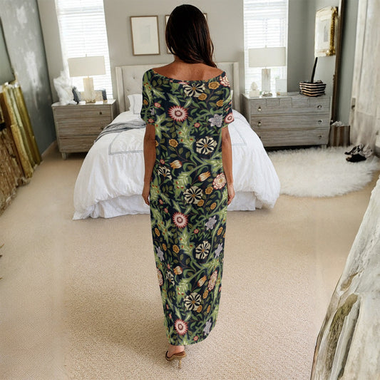 Woman in a floral dress standing in a bedroom