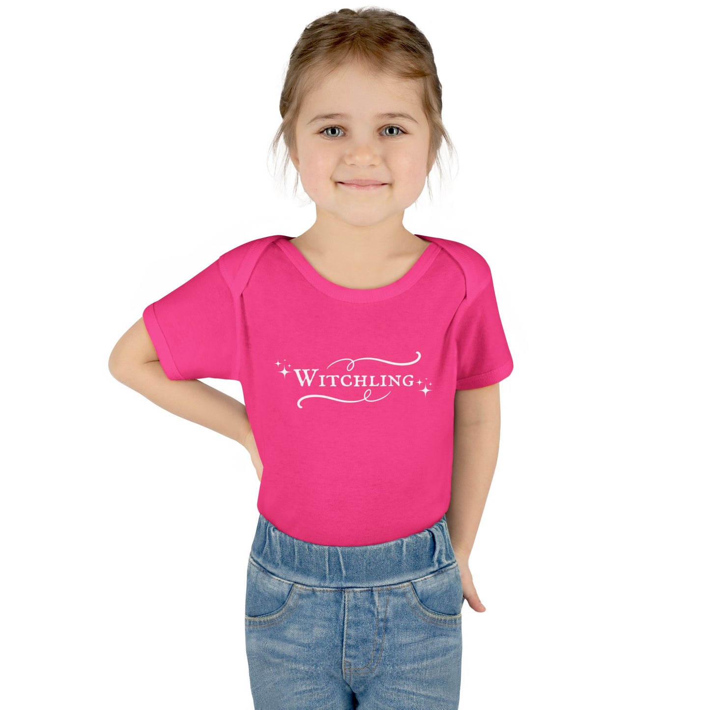 Child wearing a pink t-shirt with 'Witchling' text on a white background