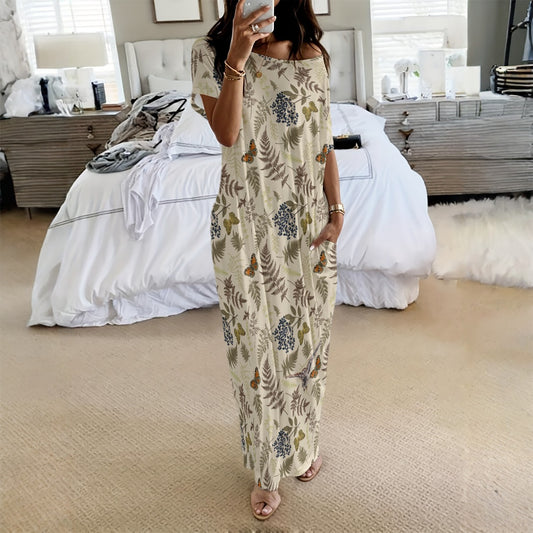 Woman taking a selfie in a floral dress in a bedroom setting