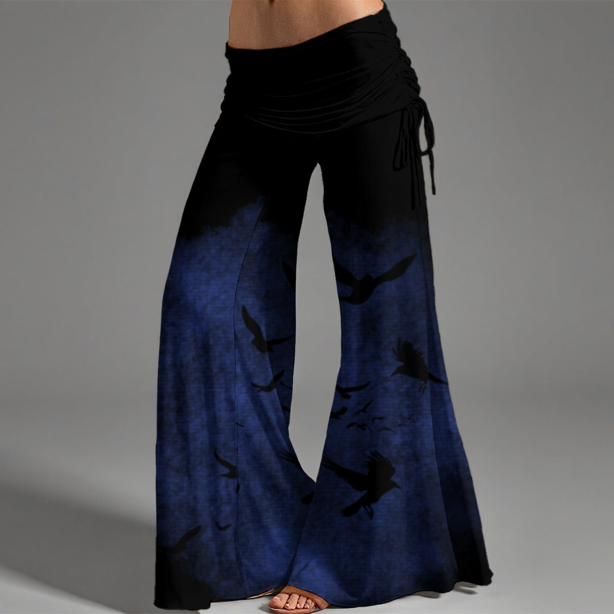 Black and blue wide-leg pants on a gray background