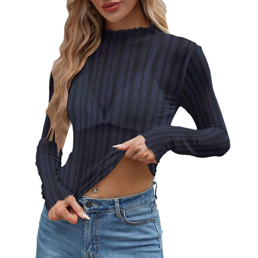 Woman wearing a black ribbed long-sleeve top and blue jeans on a white background