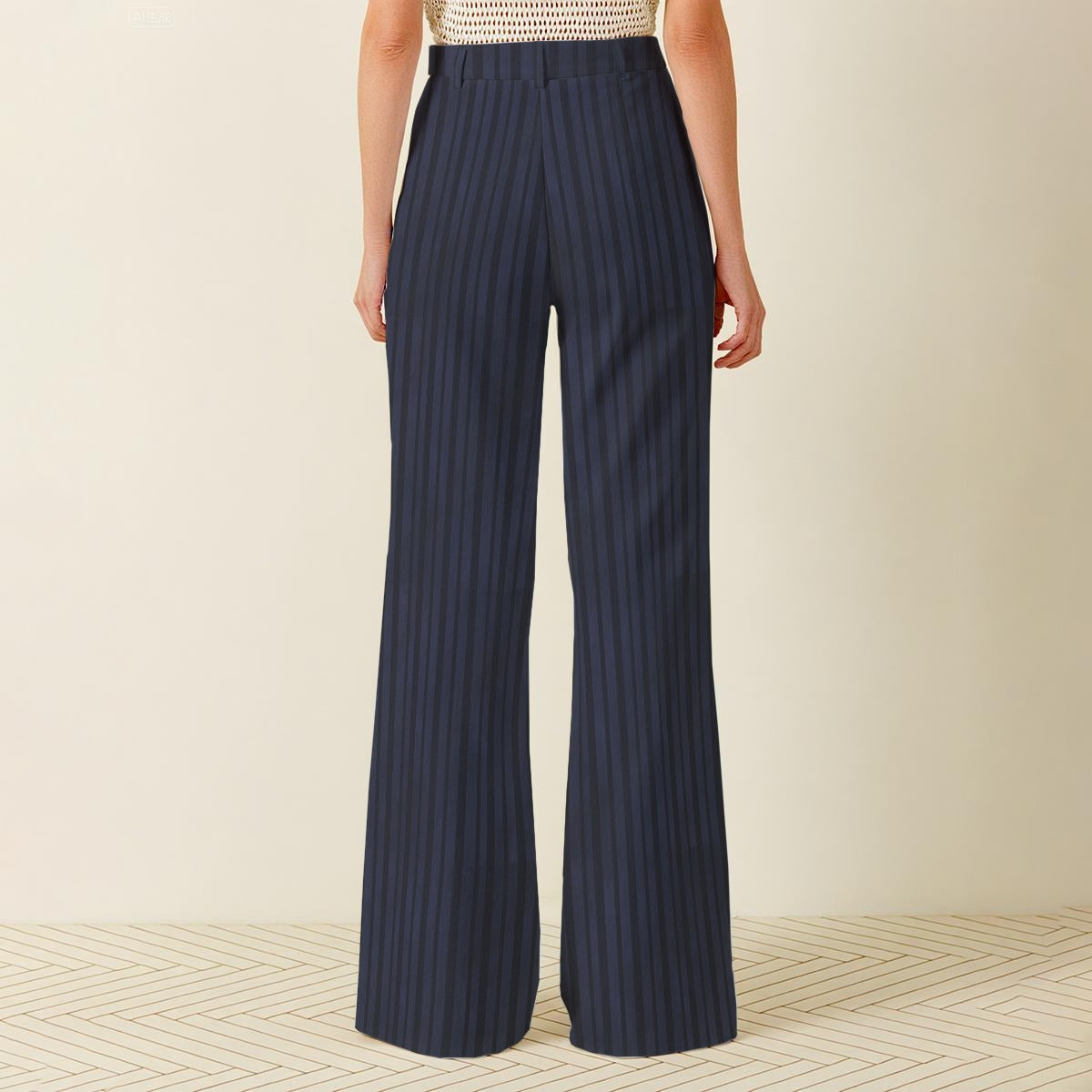 Navy striped pants worn by a person on a neutral background