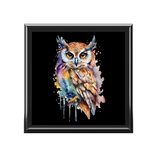 Framed artwork of a colorful owl on a black background