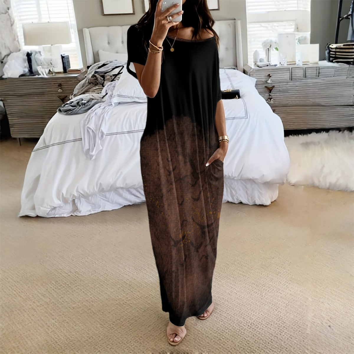 Person wearing a black and brown gradient dress in a bedroom setting.