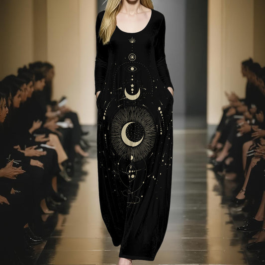 Model wearing a black dress with celestial design on a runway.