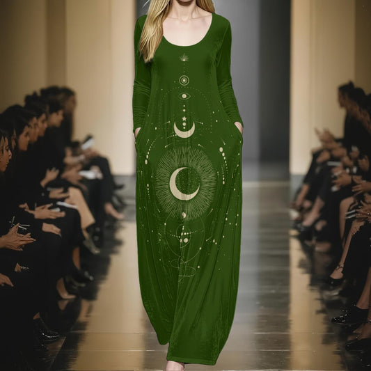 Model wearing a green dress with celestial design on a runway