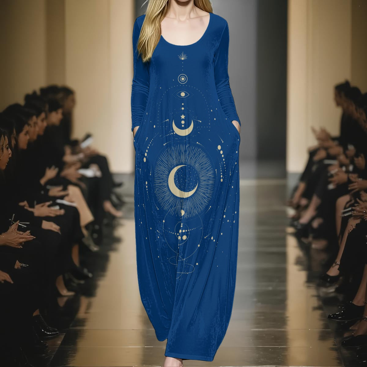 Model wearing a blue dress with celestial design on a runway