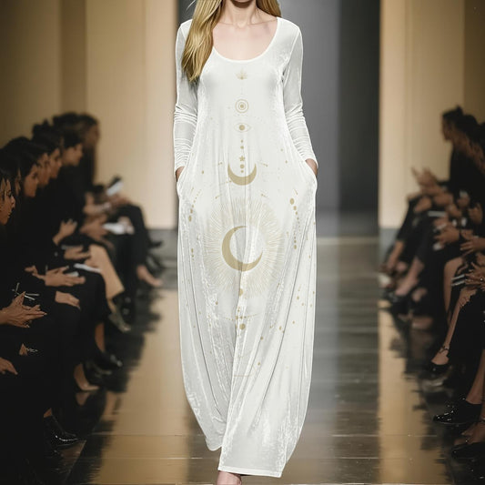 Model wearing a white dress with gold patterns on a runway