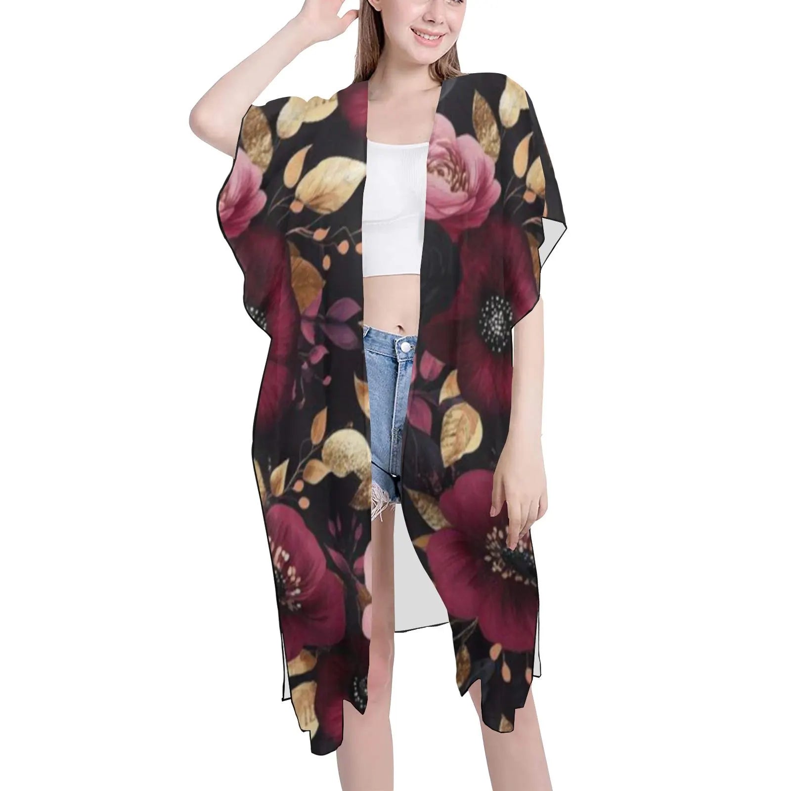 Woman wearing a floral kimono-style garment on a white background