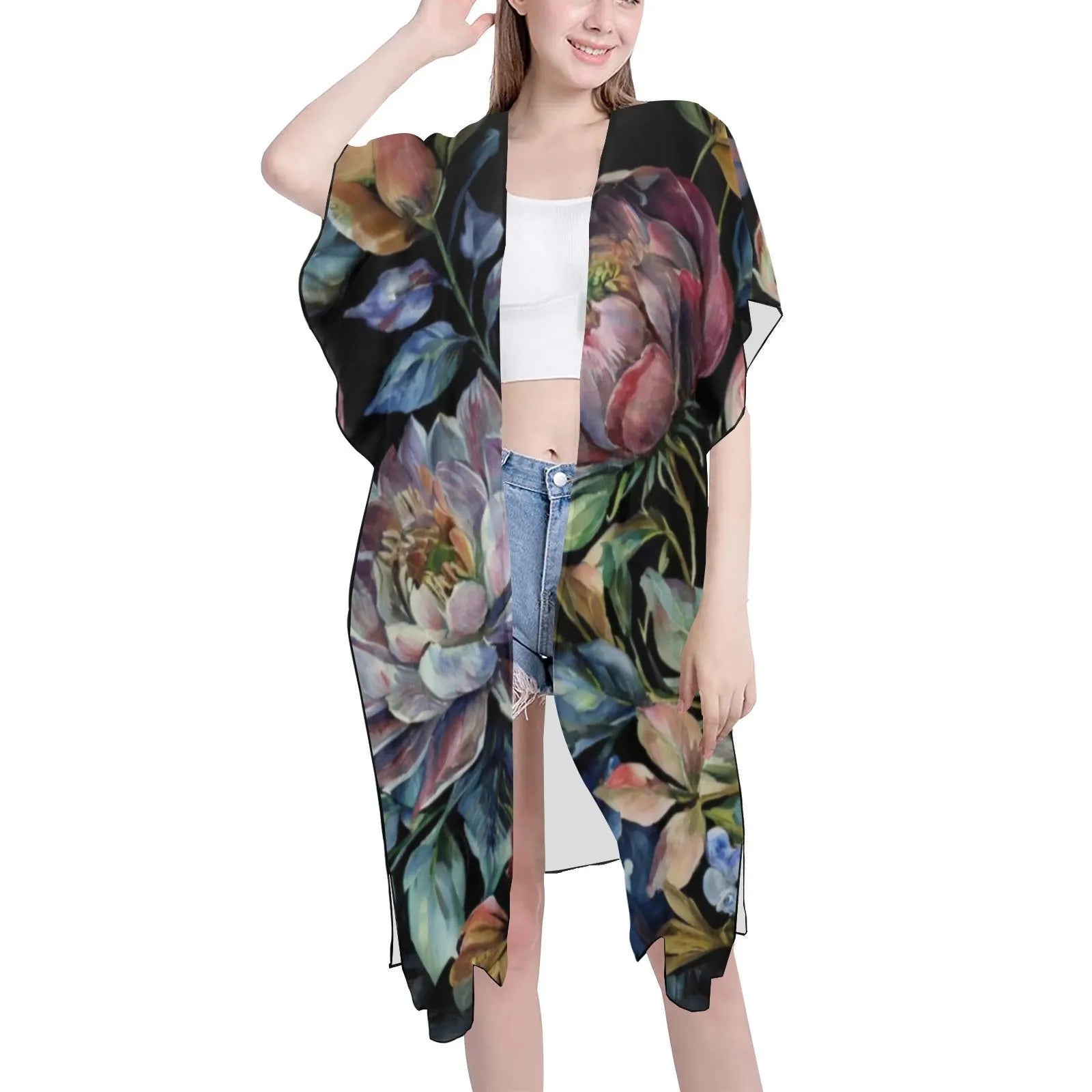Woman wearing a floral kimono-style garment on a white background