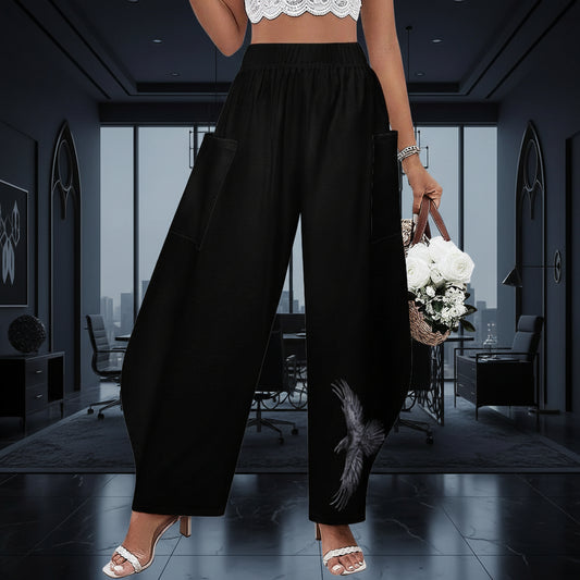 Black wide-leg pants worn by a person in a corporate room