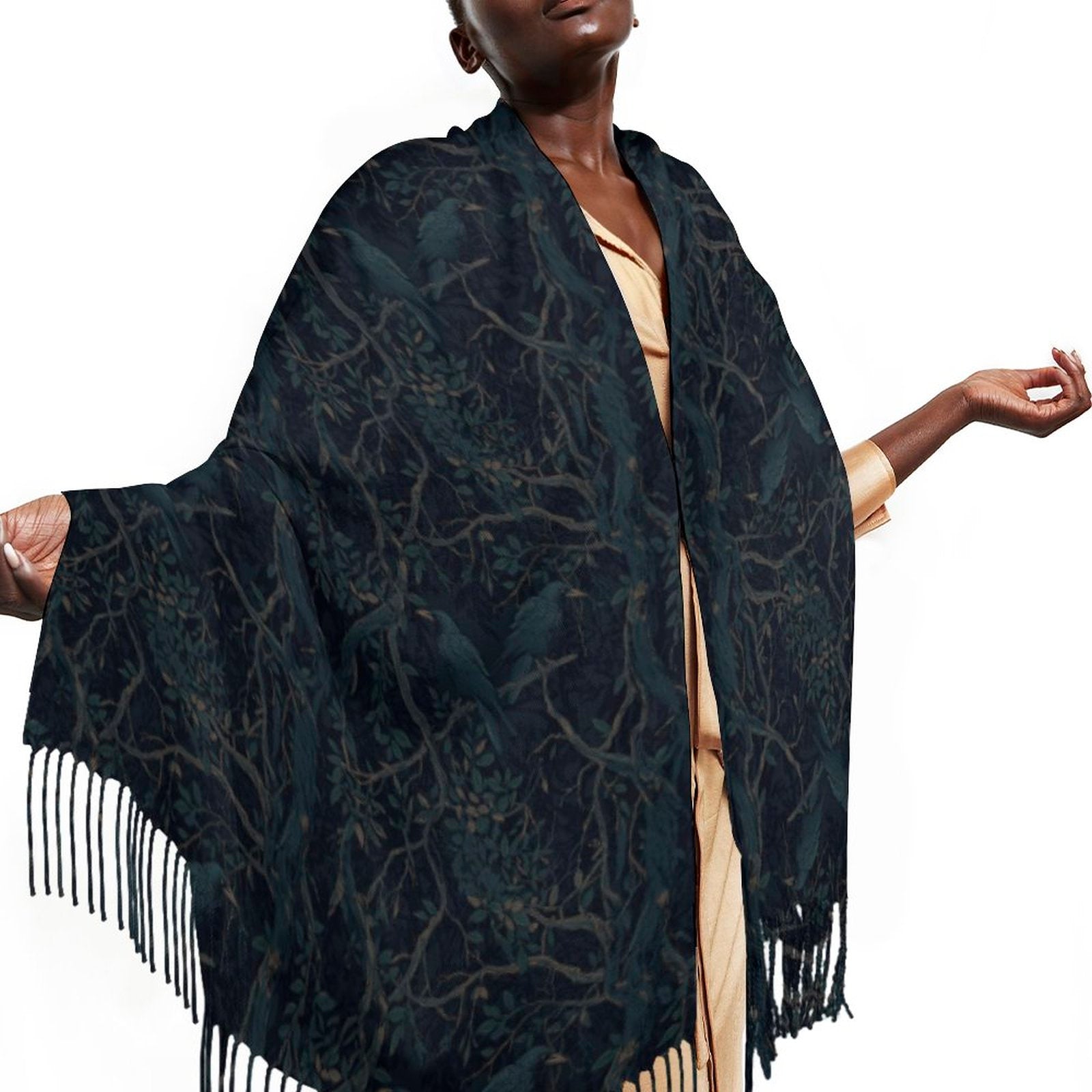 Woman wearing a dark blue patterned scarf with fringes on a white background