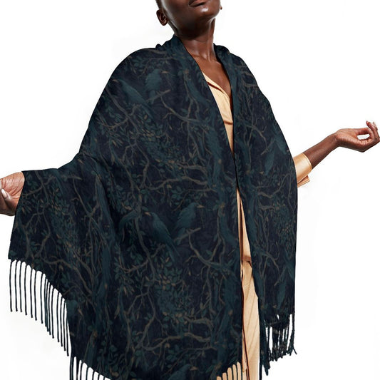 Woman wearing a dark blue patterned scarf with fringes on a white background