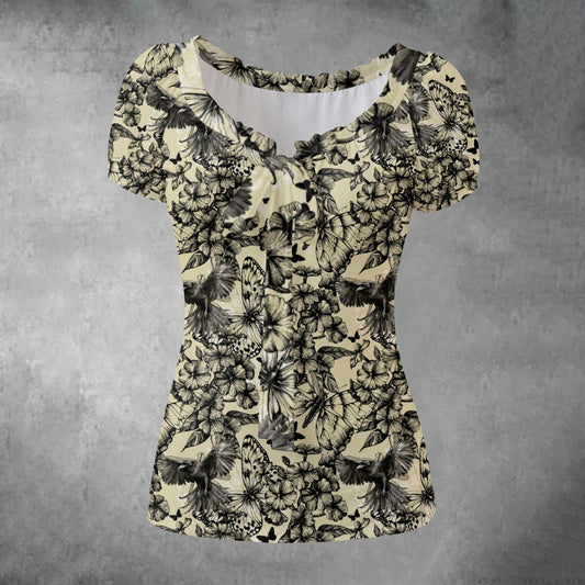 Floral patterned top on a textured gray background