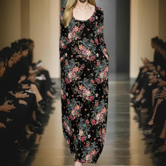 Model walking down a runway wearing a black floral dress with birds.