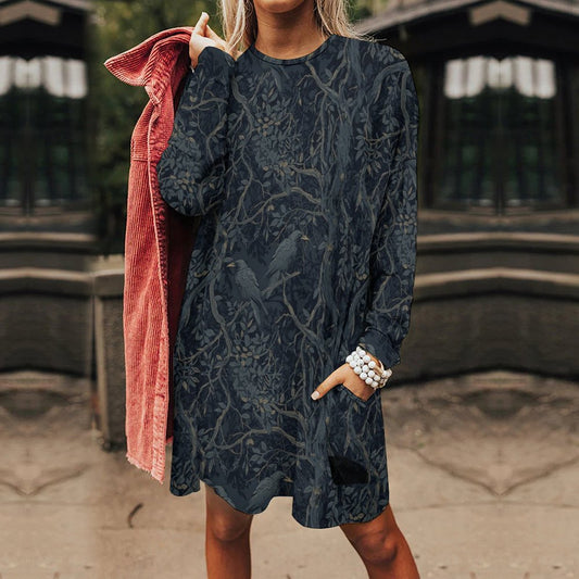 Person wearing a dark patterned dress with a blurred background