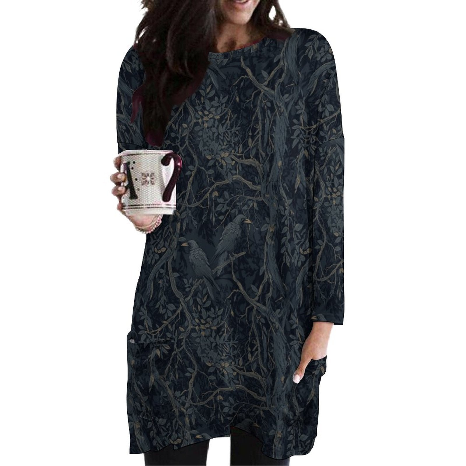 Woman wearing a dark floral patterned dress holding a mug on a white background