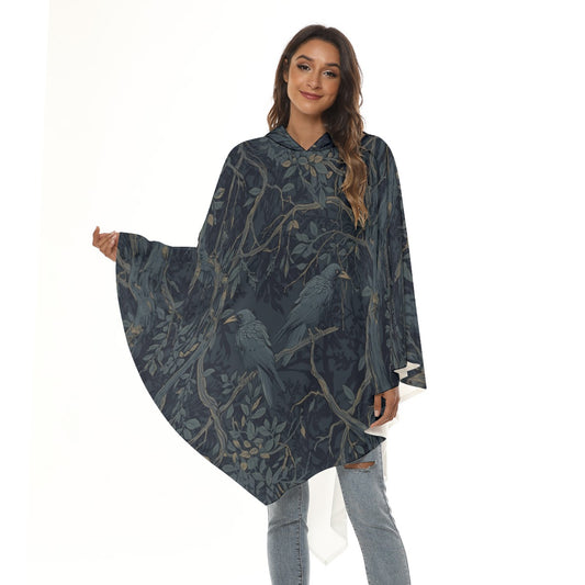 Woman wearing a dark blue patterned poncho on a white background