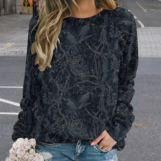 Person wearing a dark floral patterned sweater with a blurred background