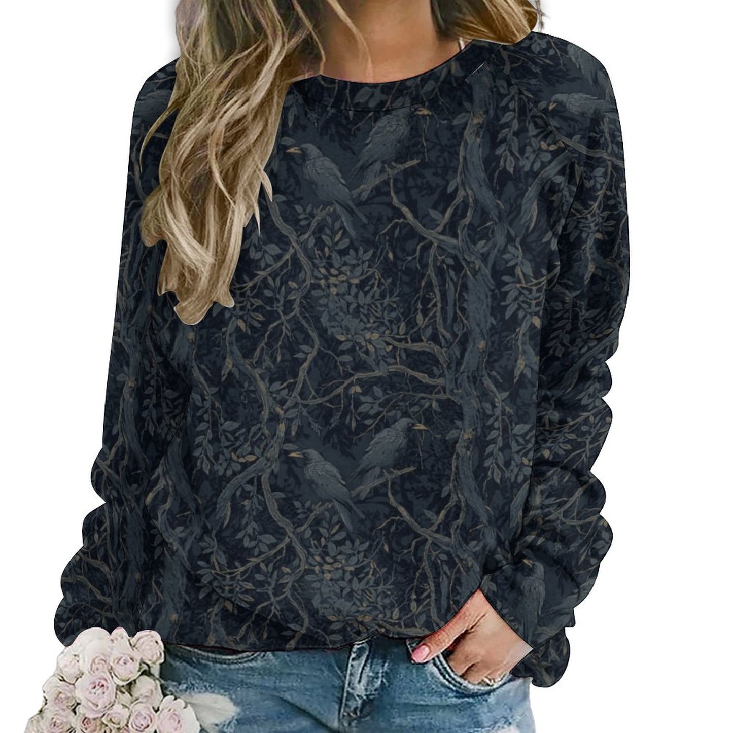 Black floral patterned sweatshirt worn by a person on a white background