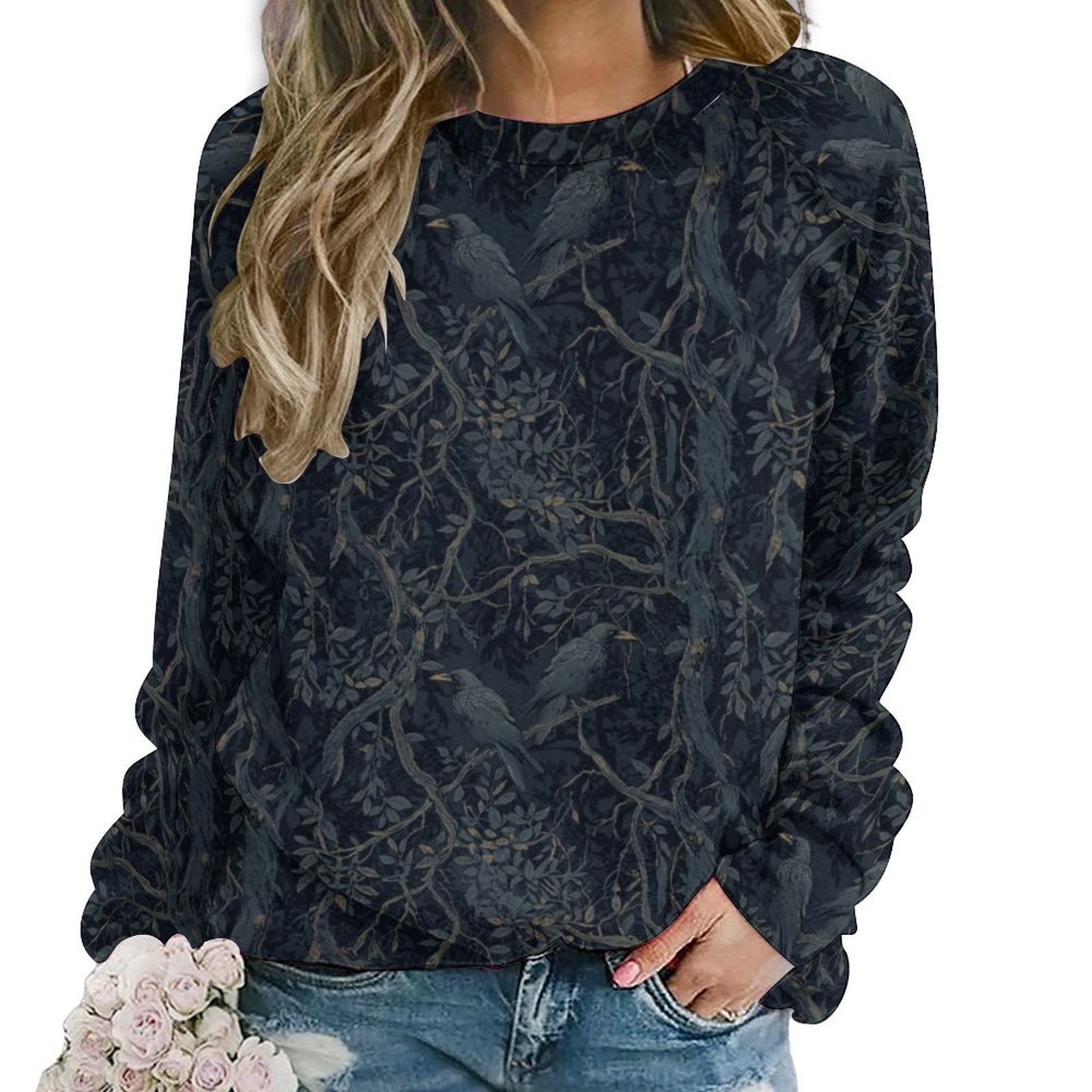 Black floral patterned sweatshirt worn by a person on a white background