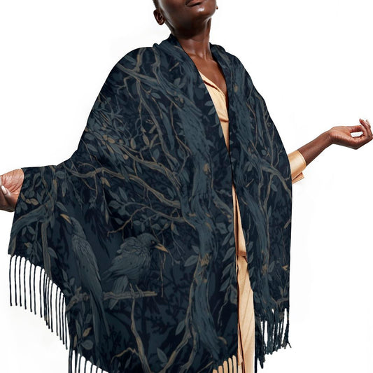 Woman wearing a dark blue patterned shawl with fringes on a white background