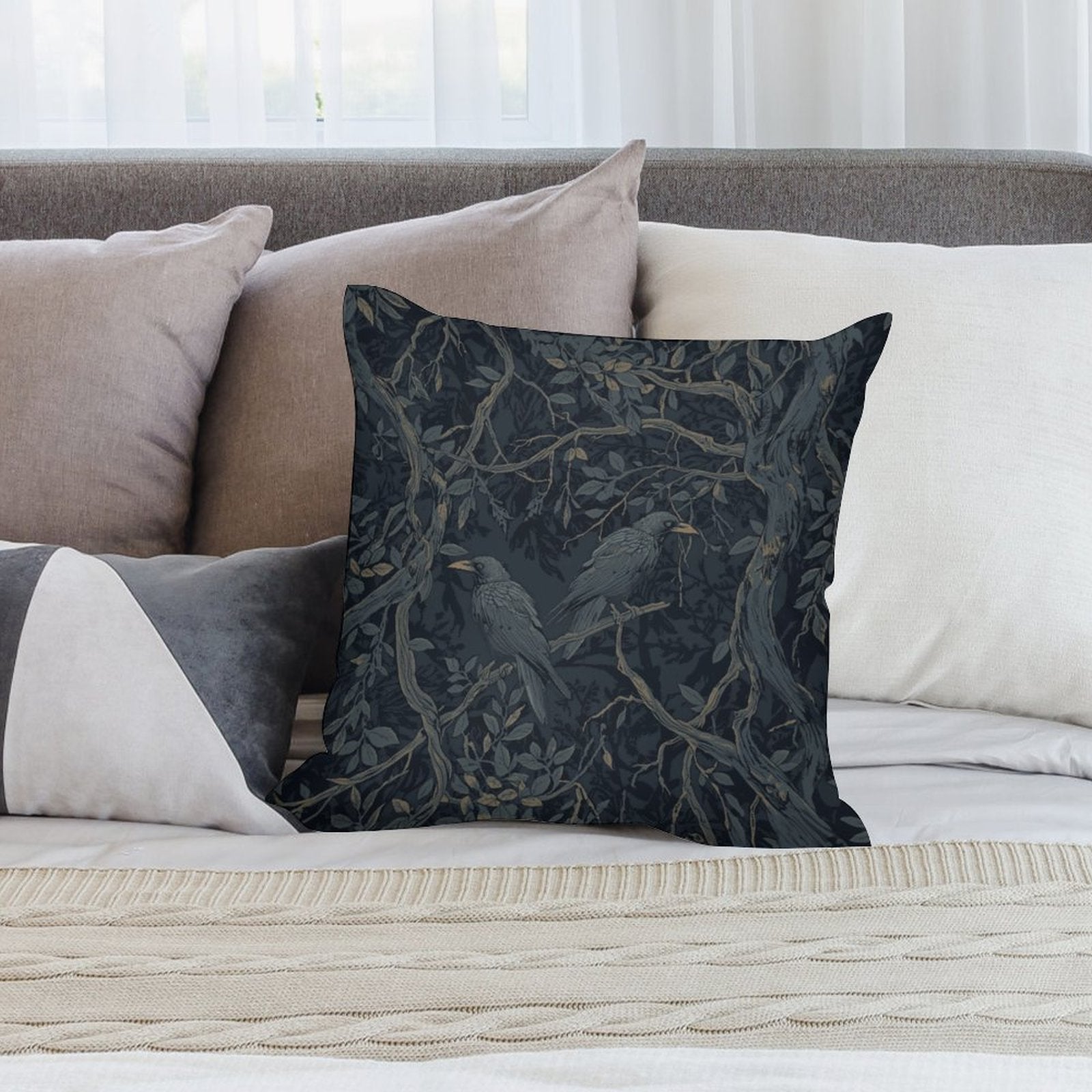 Decorative pillow with bird design on a sofa with other pillows.