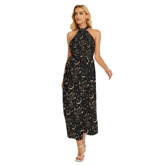 Woman wearing a black dress with gold patterns on a white background