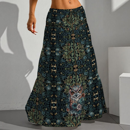 Long patterned skirt with owl design worn by a person against a neutral background