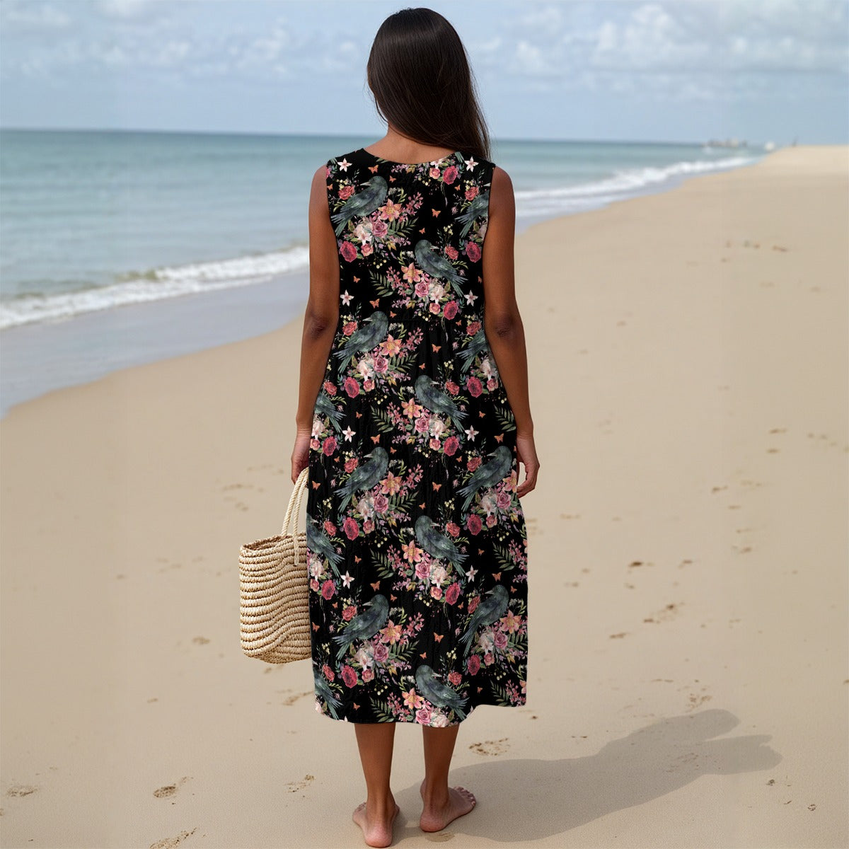 Woman in a floral dress standing on a beach