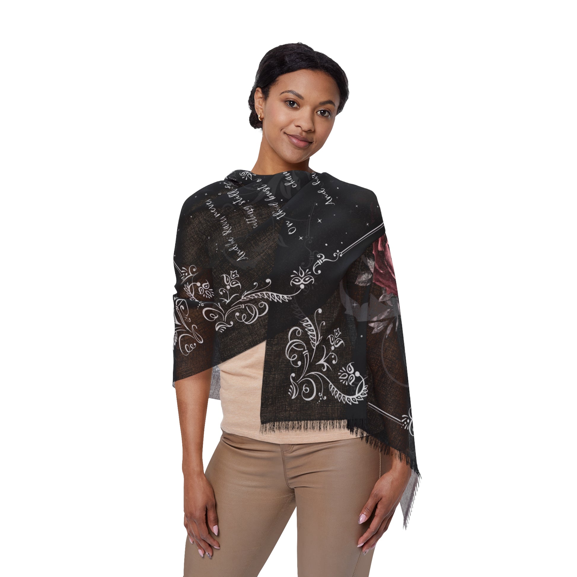 Woman wearing a black embroidered shawl on a white background