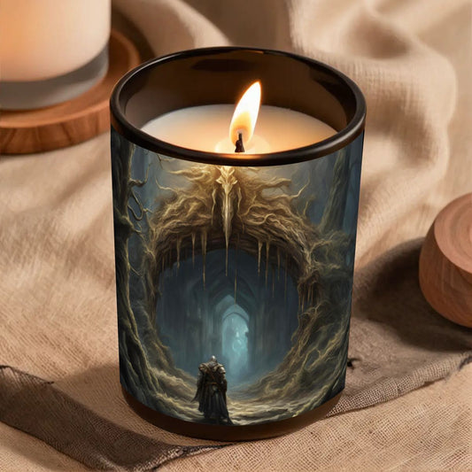 Candle in a decorative glass holder with a fantasy design on a textured surface