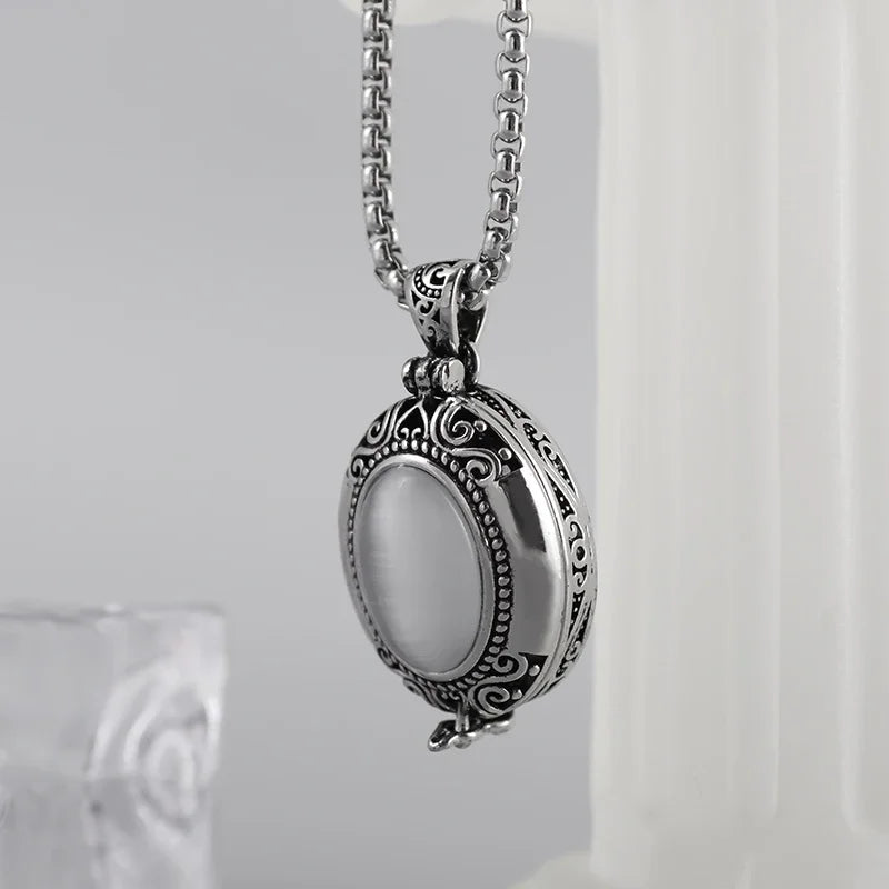 Silver locket necklace on a white background