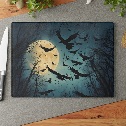 Decorative cutting board with crows and moon design on a gray surface